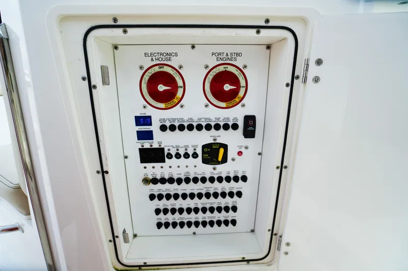 Slide: The Image of Electrical control panel on a 2020 Pursuit OS 325 Offshore boat. - 17