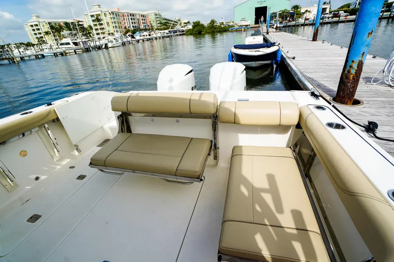 Slide: The Image of 2020 Pursuit OS 325 Offshore boat interior at marina dock. - 10