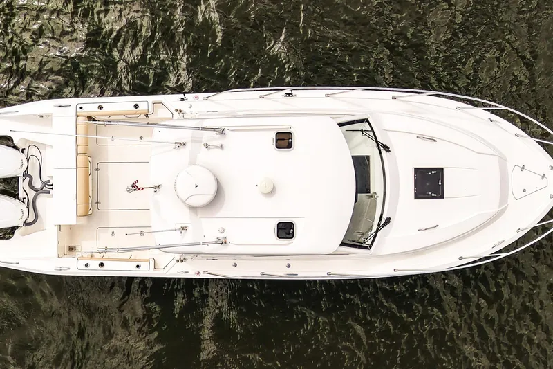 Slide: The Image of Aerial view of 2020 Pursuit OS 325 Offshore boat on water. - 4