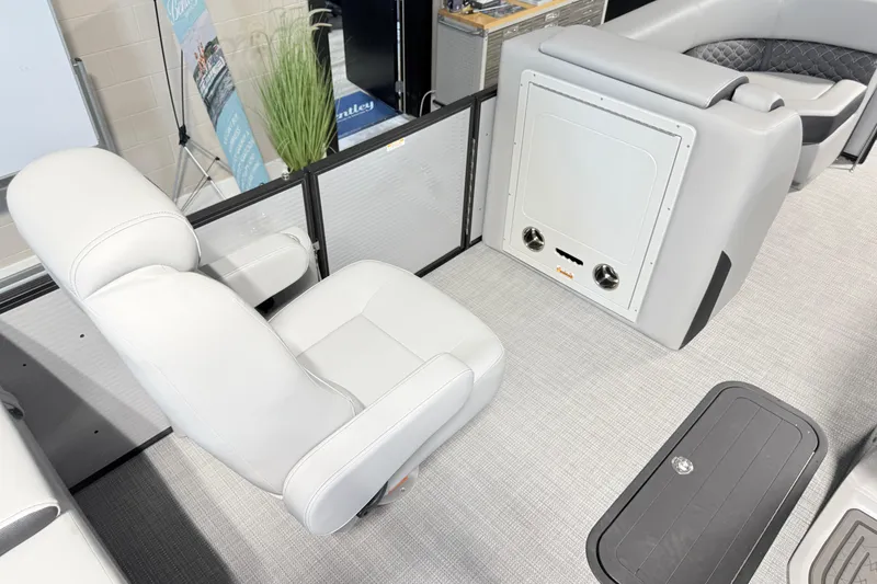 Slide: The Image of Luxurious interior of 2026 Manitou Encore Sl SHP575 pontoon boat with plush seating. - 13