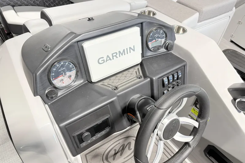 Slide: The Image of 2026 Manitou Encore SL SHP575 dashboard with Garmin display and steering wheel. - 15