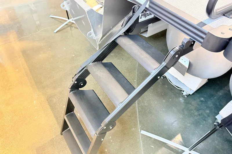 Slide: The Image of Manitou Encore Sl SHP575 2026 boat ladder on polished floor background. - 8