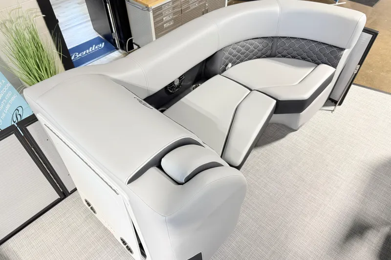 Slide: The Image of Luxurious seating on 2026 Manitou Encore Sl SHP575 pontoon boat, featuring elegant gray upholstery. - 18