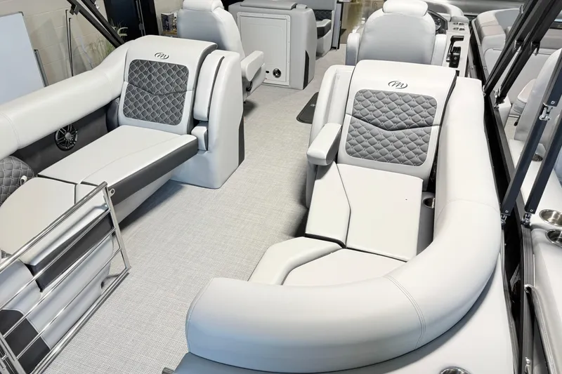 Slide: The Image of Luxurious interior of 2026 Manitou Encore Sl SHP575 pontoon boat with plush seating. - 9