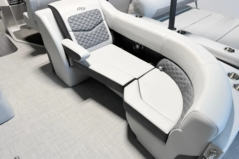Slide: The Image of Luxurious seating on 2026 Manitou Encore SL SHP575 pontoon boat with quilted upholstery. - 11