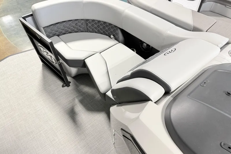 Slide: The Image of 2026 Manitou Encore SL SHP575 boat interior with luxurious seating and modern design. - 17