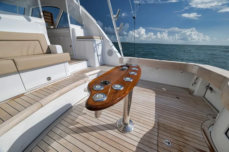 Slide: The Image of Luxurious 2023 Hatteras GT45X Tower yacht deck with elegant seating and ocean view. - 14