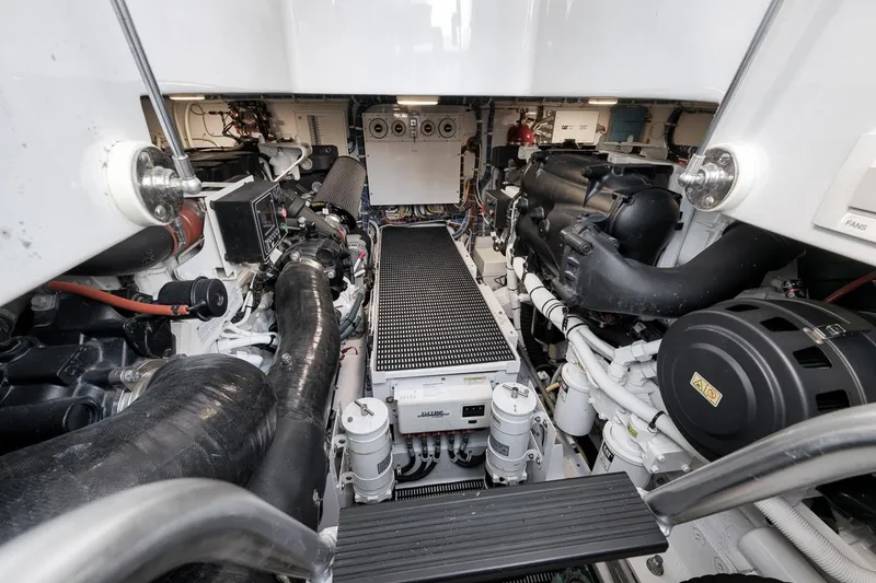 Slide: The Image of Engine room of 2023 Hatteras GT45X Tower yacht, showcasing advanced machinery and components. - 46