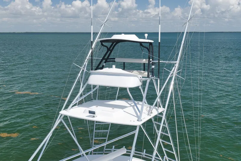 Slide: The Image of 2023 Hatteras GT45X Tower yacht on open sea with clear sky. - 7
