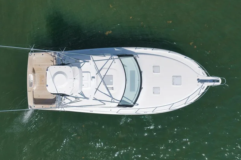 Slide: The Image of Aerial view of 2023 Hatteras GT45X Tower yacht on green water. - 8