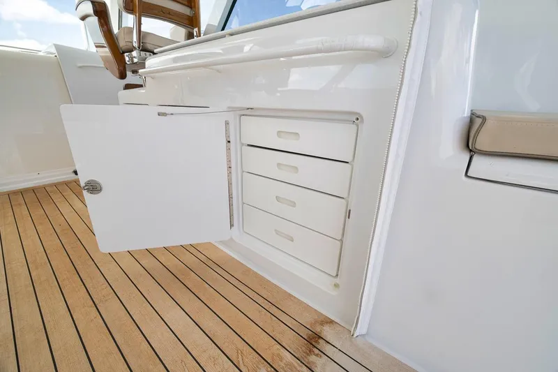 Slide: The Image of 2023 Hatteras GT45X Tower yacht interior storage drawers on teak deck. - 27