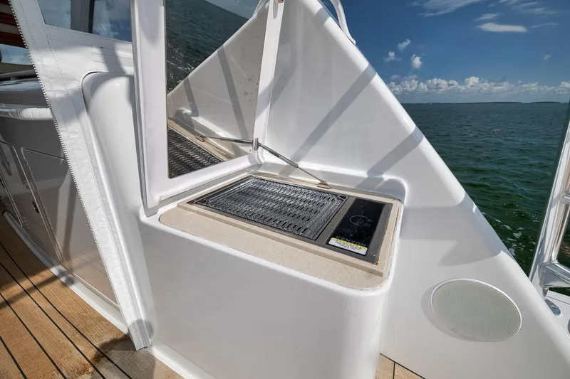 Slide: The Image of 2023 Hatteras GT45X Tower yacht with outdoor grill and ocean view. - 22