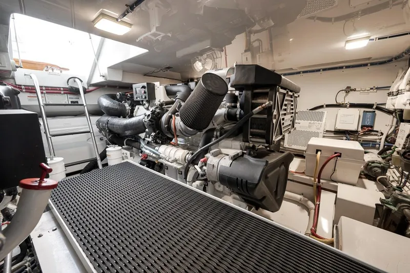 Slide: The Image of Engine room of 2023 Hatteras GT45X Tower yacht, showcasing advanced machinery and equipment. - 52