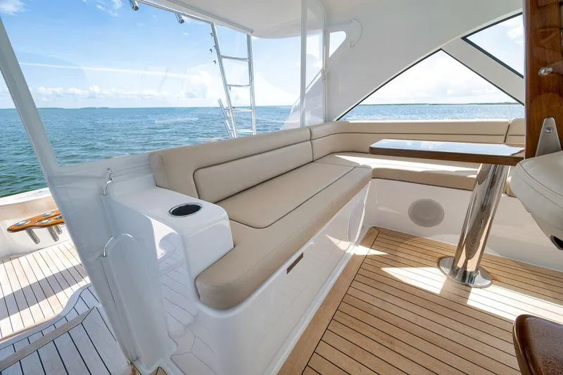 Slide: The Image of Luxurious seating area on 2023 Hatteras GT45X Tower yacht with ocean view. - 26
