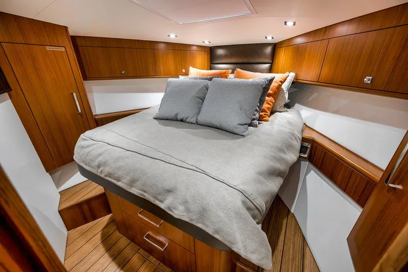 Slide: The Image of Luxurious cabin interior of 2023 Hatteras GT45X Tower yacht with elegant wood finish. - 41