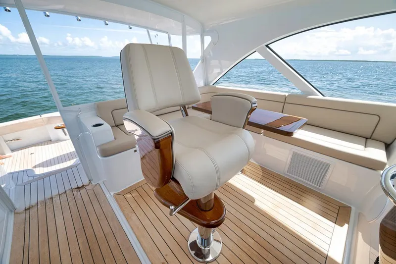Slide: The Image of Luxurious interior of 2023 Hatteras GT45X Tower yacht with elegant seating and ocean view. - 29