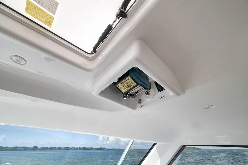 Slide: The Image of 2023 Hatteras GT45X Tower interior ceiling with hatch and ocean view. - 32