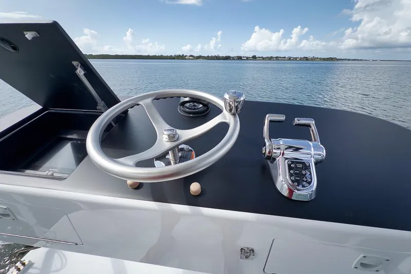 Slide: The Image of Steering console of 2023 Hatteras GT45X Tower yacht with ocean view. - 9