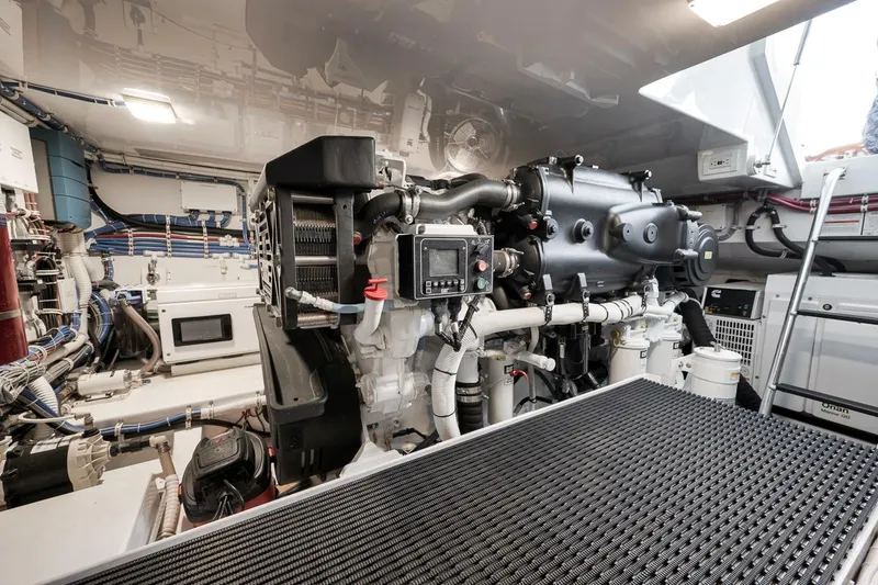 Slide: The Image of Engine room of 2023 Hatteras GT45X Tower yacht, showcasing advanced machinery and equipment. - 49