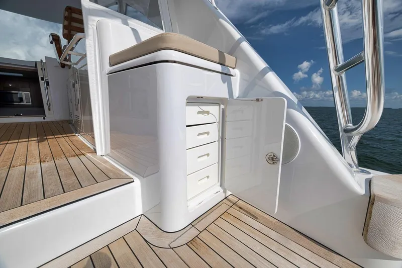 Slide: The Image of 2023 Hatteras GT45X Tower yacht deck with open storage compartment. - 21