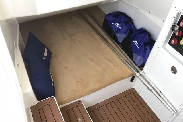 Slide: The Image of Interior cabin of 2016 Cobia 344 Center Console with storage bags and cushions. - 14