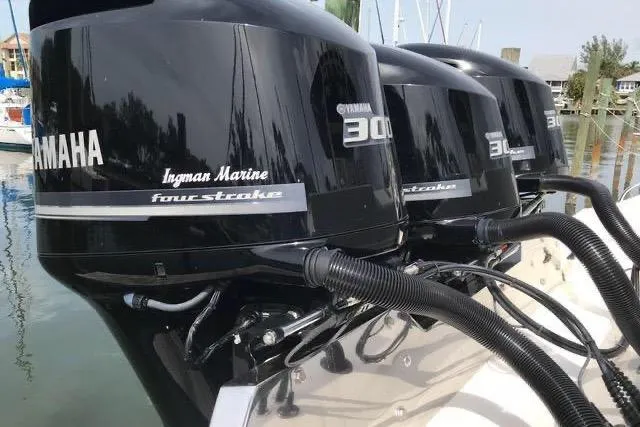 Slide: The Image of Triple Yamaha 300 outboard engines on a 2016 Cobia 344 Center Console boat. - 5