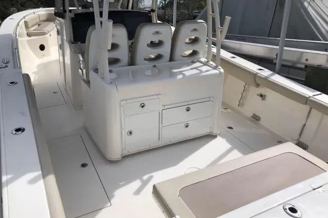 Slide: The Image of 2016 Cobia 344 Center Console boat interior with seating and storage compartments. - 8