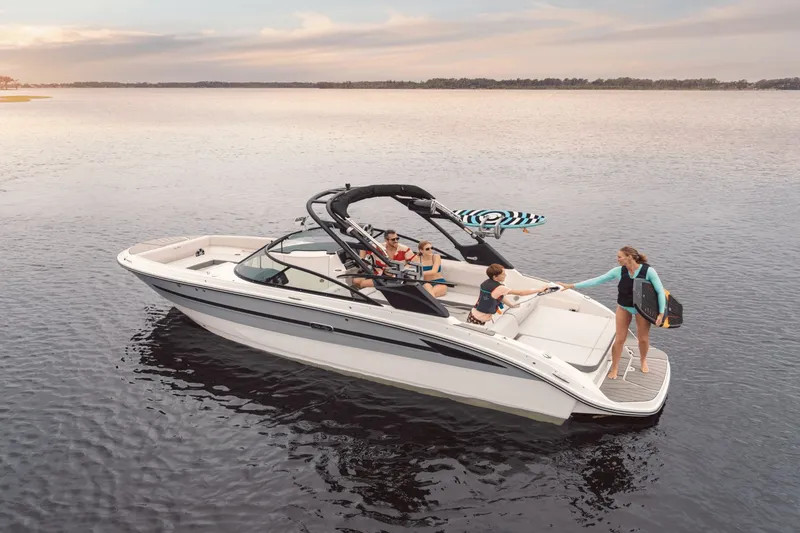 Slide: The Image of 2025 Sea Ray SDX 270 Surf on calm water with several people on board. - 5
