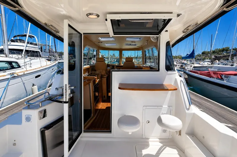 Slide: The Image of Interior view of a 2014 Aspen C100 boat docked at a marina. - 4