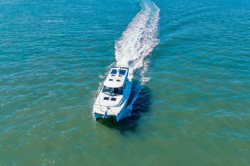 Slide: The Image of Aerial view of 2014 Aspen C100 boat cruising on open water. - 6