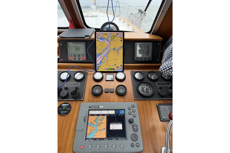 Slide: The Image of Helm of 2002 Menorquin 110 boat with navigation and control instruments. - 13