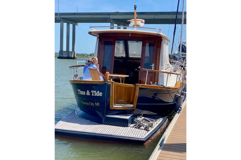 Slide: The Image of 2002 Menorquin 110 yacht docked, featuring "Time & Tide" name, Traverse City, MI. - 3