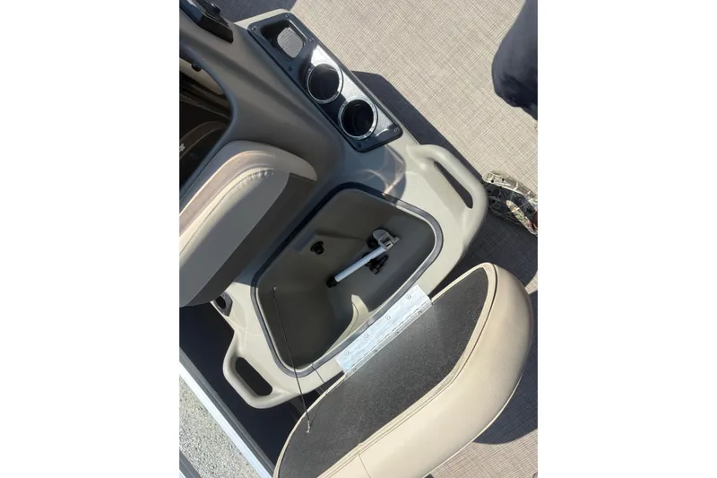 Slide: The Image of 2024 Sun Tracker Bass Buggy 16 DLX interior storage compartment with cup holders. - 10