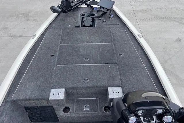 Slide: The Image of 2021 Tracker Pro Team 195 TXW Tournament Edition boat deck with fishing equipment. - 4