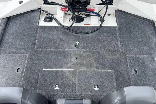 Slide: The Image of 2021 Tracker Pro Team 195 TXW Tournament Edition boat interior with carpeted deck and seating. - 7