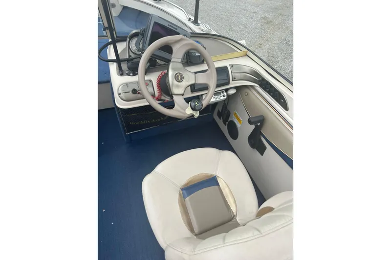 Slide: The Image of 2001 Crestliner 1850 O/B boat interior with steering wheel and control panel. - 5