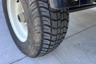 Slide: The Image of Close-up of a 2012 Avalon Tahoe tire on a concrete surface. - 18