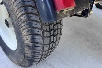 Slide: The Image of Close-up of a 2012 Avalon Tahoe tire on a concrete surface. - 19
