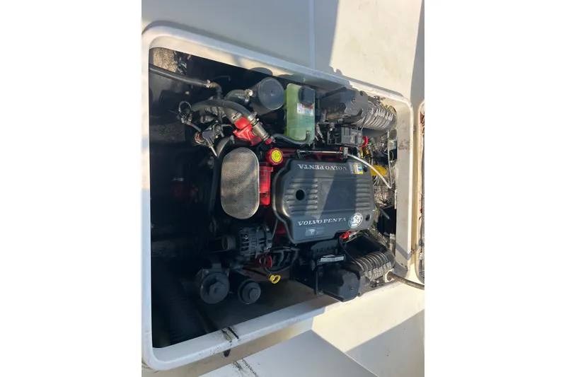 Slide: The Image of Engine compartment of 2004 Hunt Yachts Surfhunter 29 with Volvo Penta engine. - 24