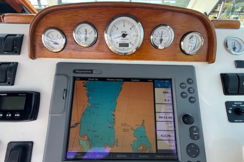 Slide: The Image of Control panel of a 2004 Hunt Yachts Surfhunter 29 with navigation display and gauges. - 12