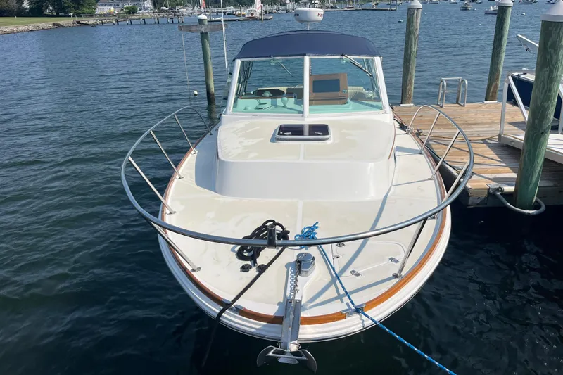 Slide: The Image of 2004 Hunt Yachts Surfhunter 29 docked, showcasing sleek design and spacious deck. - 6