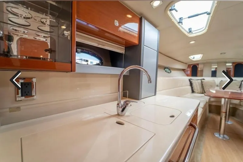 Slide: The Image of Luxurious interior of 2011 Formula 400 Super Sport yacht with modern kitchen and seating area. - 16