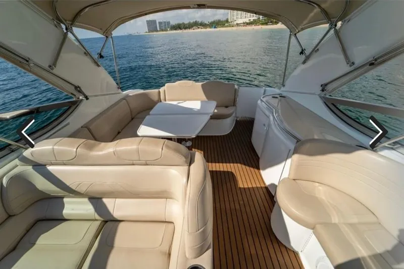 Slide: The Image of Luxurious 2011 Formula 400 Super Sport yacht interior with beige seating and ocean view. - 6