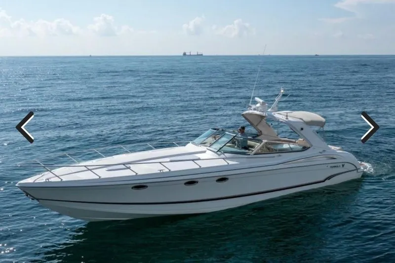 The Image of 2011 Formula 400 Super Sport yacht cruising on open sea under clear skies. - 0