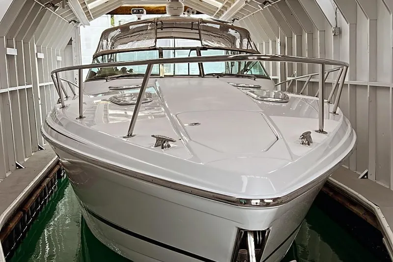 Slide: The Image of 2011 Formula 400 Super Sport boat docked in a covered marina. - 4