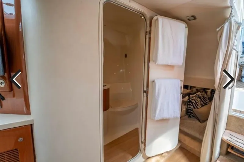 Slide: The Image of Interior of 2011 Formula 400 Super Sport yacht with bathroom and cozy seating area. - 17