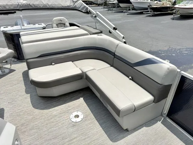 Slide: The Image of The image shows the seating area on a Bennington 22 SXSAPG pontoon boat. - 8