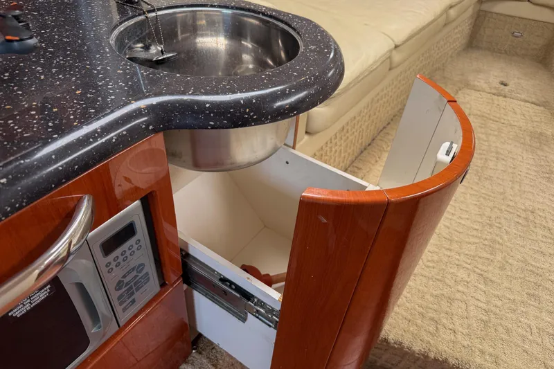 Slide: The Image of Interior of 2007 Formula 400 Super Sport yacht with sink, microwave, and storage. - 39