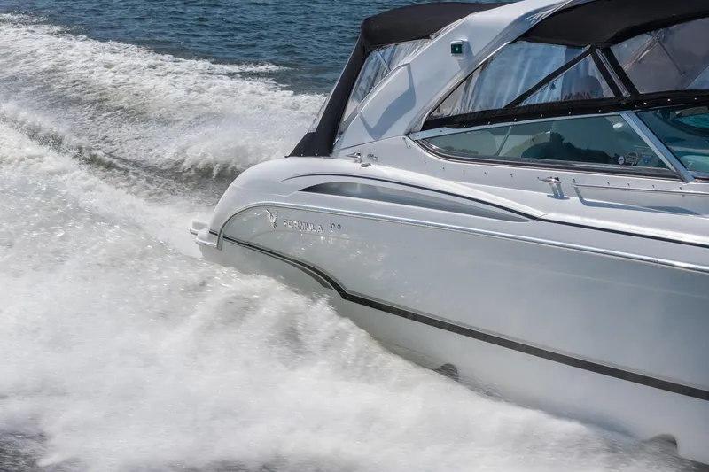 Slide: The Image of 2007 Formula 400 Super Sport boat cruising on water, creating dynamic waves. - 8