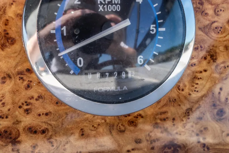 Slide: The Image of Close-up of a 2007 Formula 400 Super Sport RPM gauge on a wooden dashboard. - 35